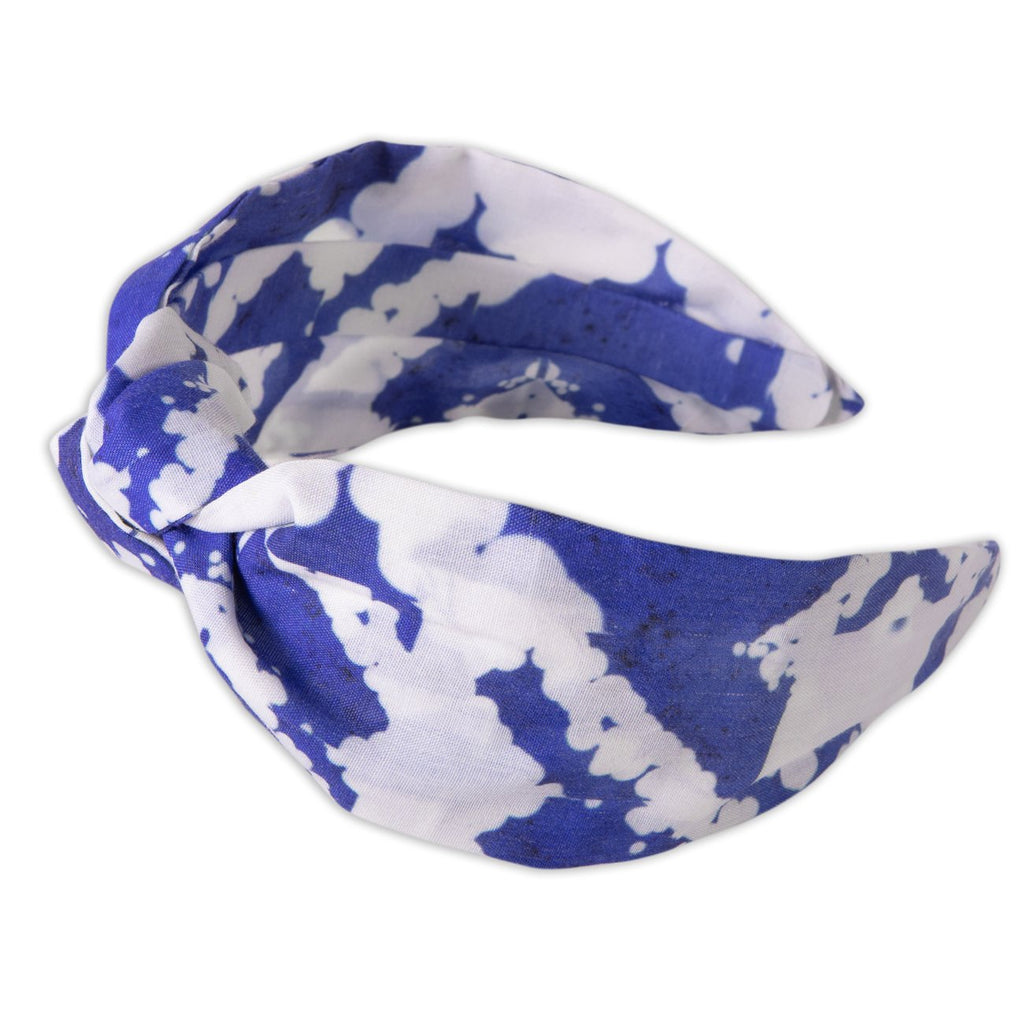 A Kate Whyley wide, knotted headband with a Yves Klein blue and white pattern, called Klein NY