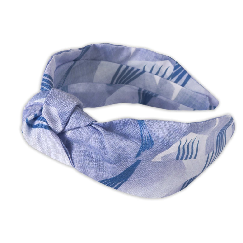 A Kate Whyley wide, knotted headband in blue hues, called Fan Flight