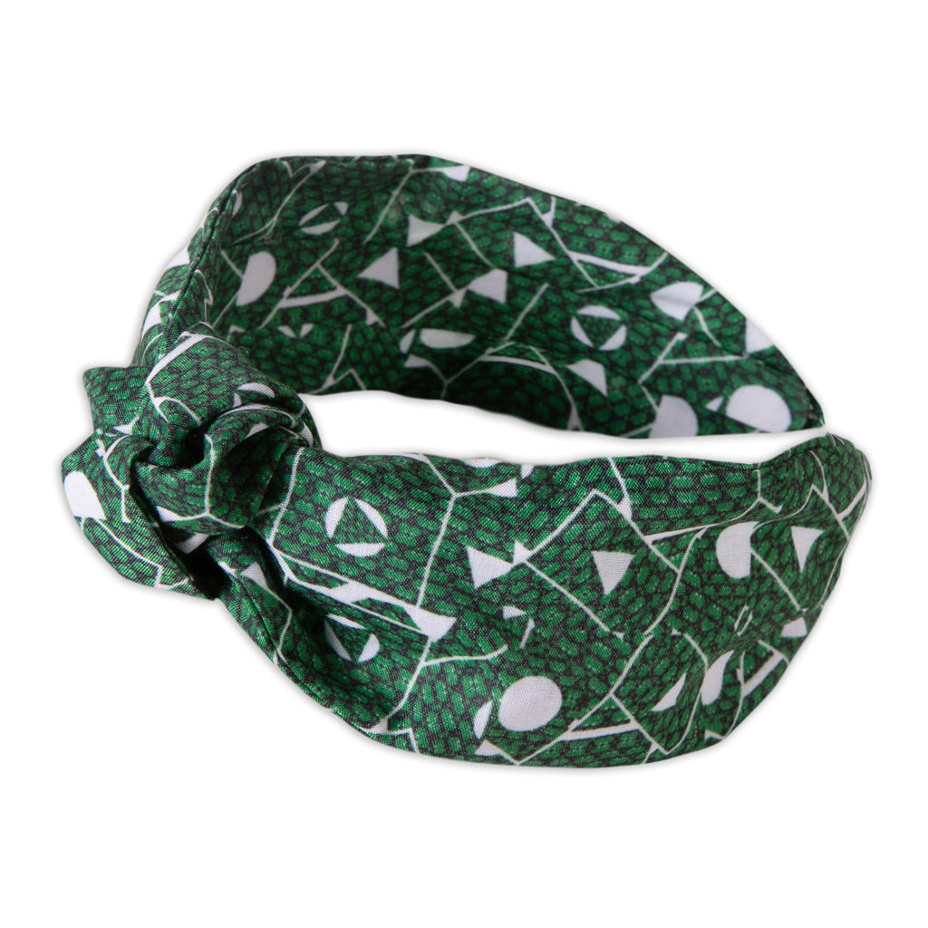 A Kate Whyley wide, knotted headband with a green and white pattern, called Topiary