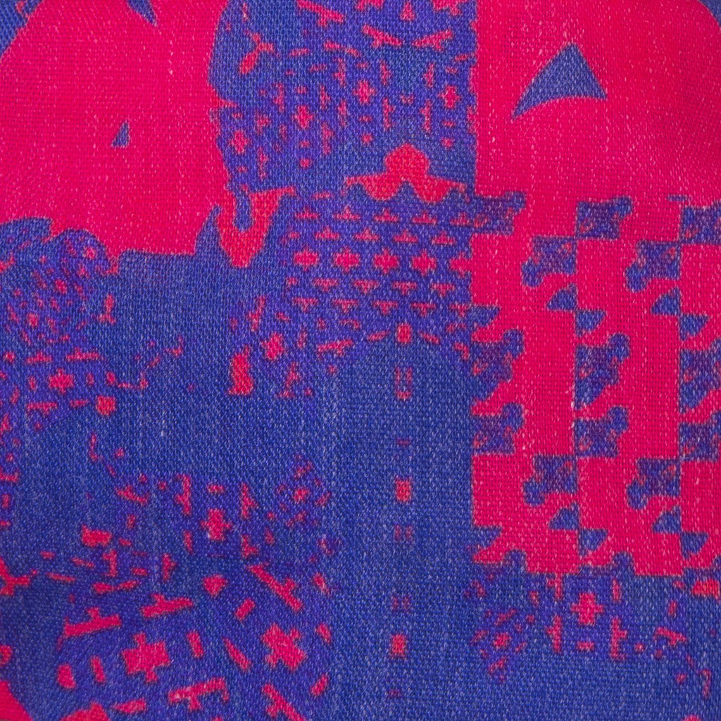 A close up image of the Kate Whyley wide, knotted headband cotton fabric - in cobalt blue and fuchsia pink design
